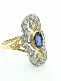 Anello in oro giallo e bianco con zaffiro e diamanti