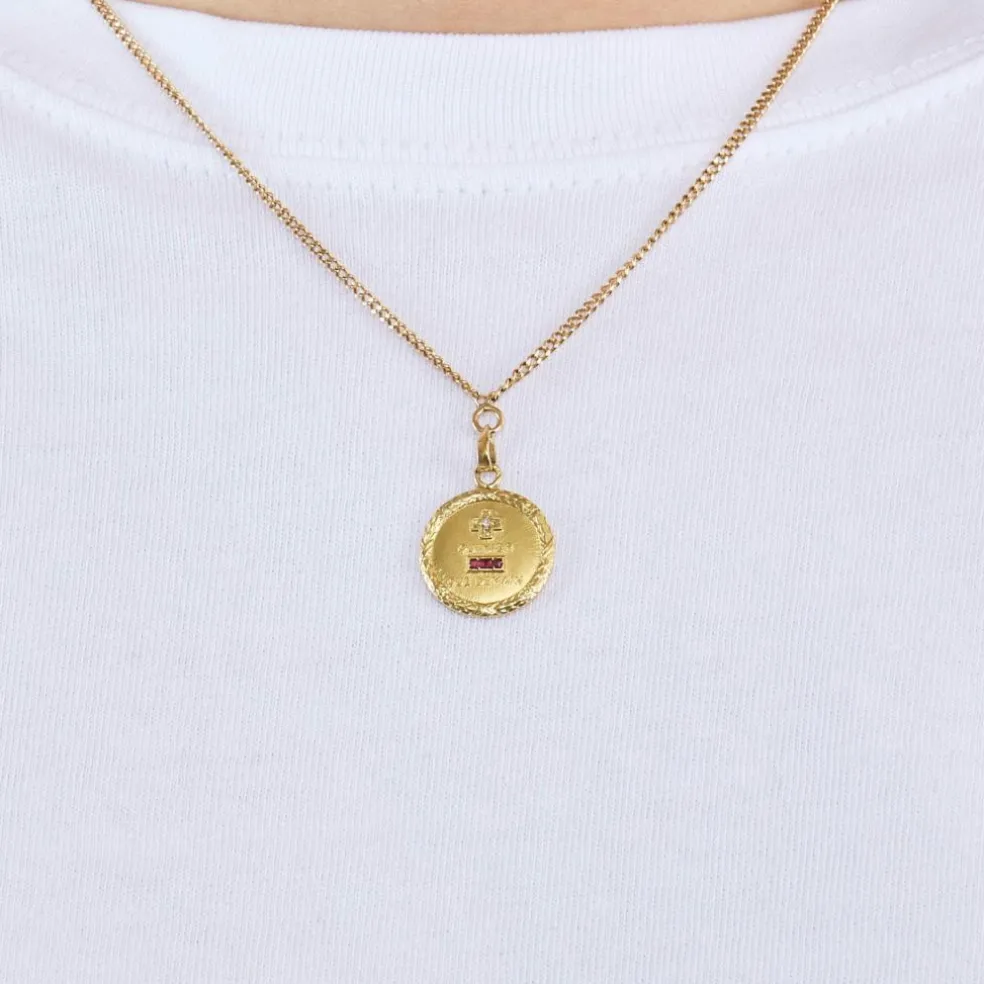 AUGIS - Collier en or jaune retenant une médaille sentimentale