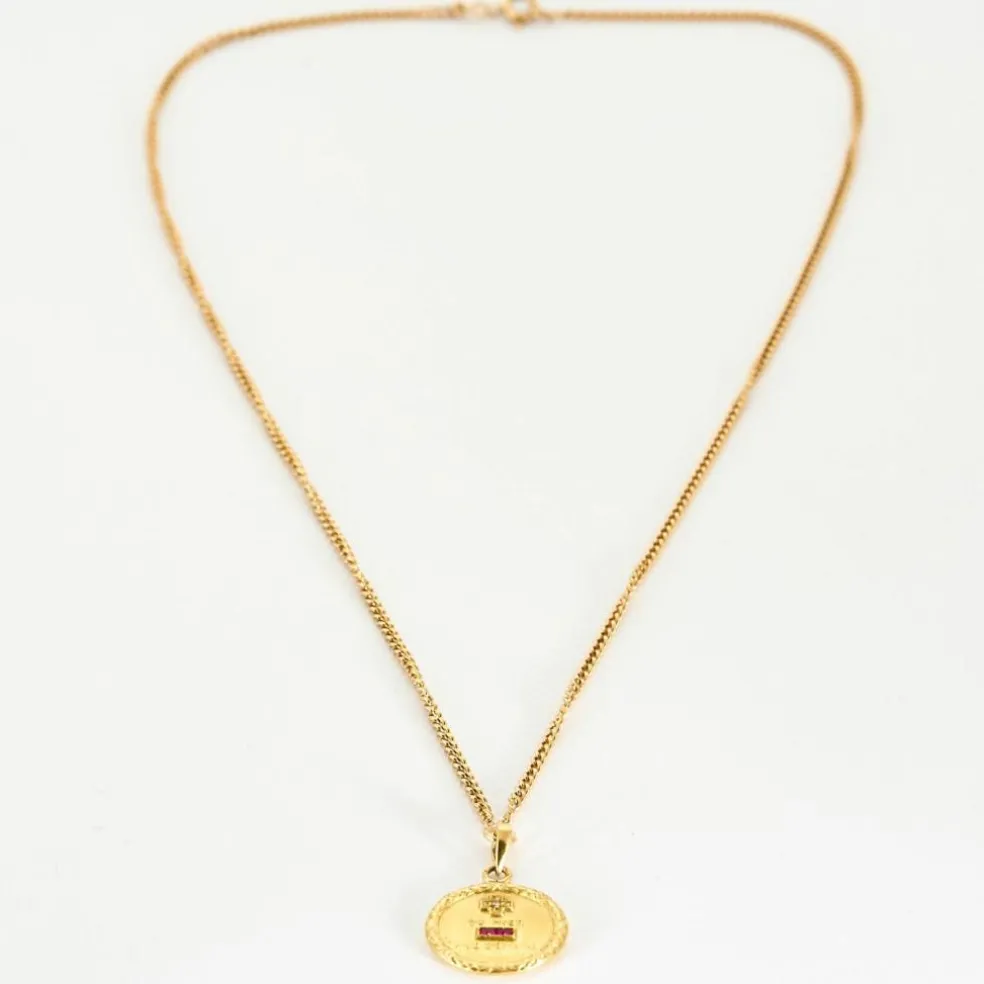 AUGIS - Collier en or jaune retenant une médaille sentimentale