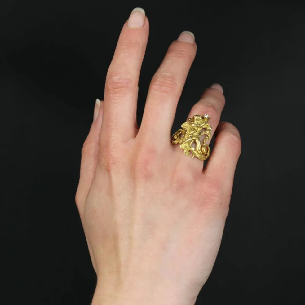 Bague ancienne angelot en or et son diamant