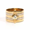 Bague Années 70 or jaune et blanc, diamant taille baguette