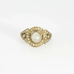 Bague Art déco, deux ors, perle bouton et diamants