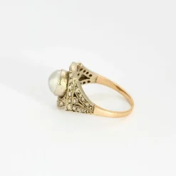 Bague Art déco, deux ors, perle bouton et diamants
