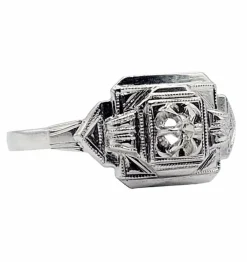 Bague art deco or blanc 18k ornée d'un diamant rond dans une monture géométrique finement travaillée (circa 1930)