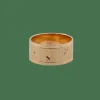 Bague bandeau en or jaune avec étoiles