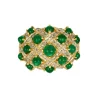 Bague boule deux ors, émeraudes cabochons et diamants