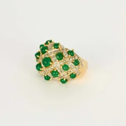 Bague boule deux ors, émeraudes cabochons et diamants