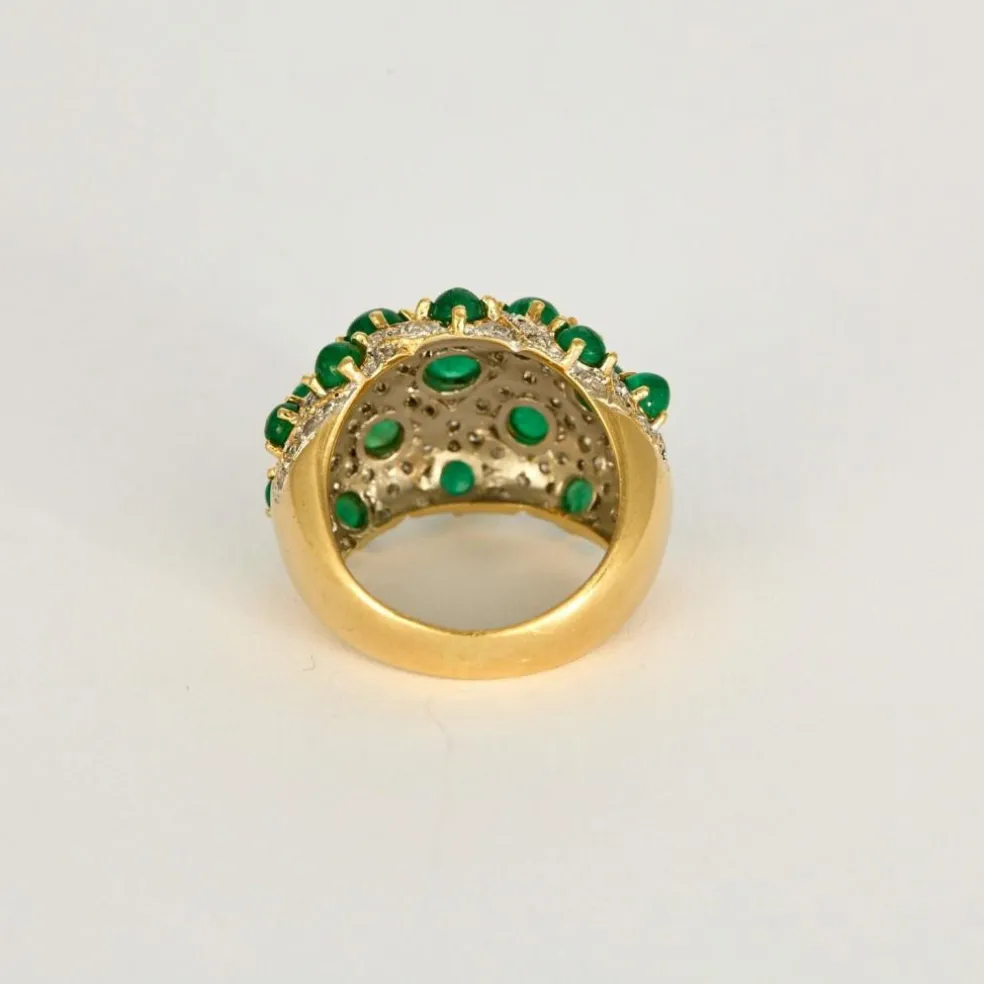 Bague boule deux ors, émeraudes cabochons et diamants