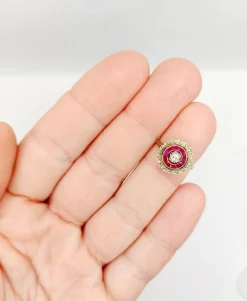 Bague cible Art Déco or rose, diamant, rubis calibrés (circa 1920)