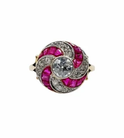 Bague cible tourbillon art deco or jaune diamant et rubis calibrés