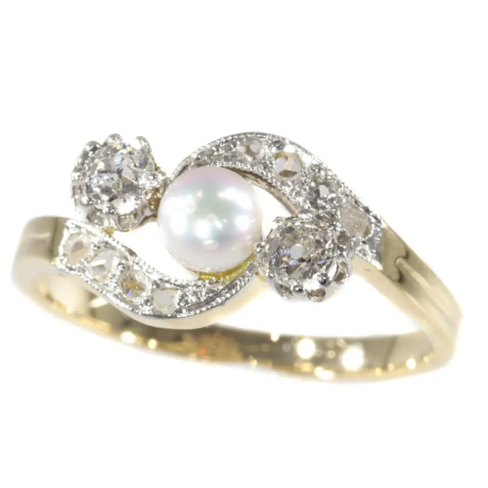 Bague croisée diamant et perle