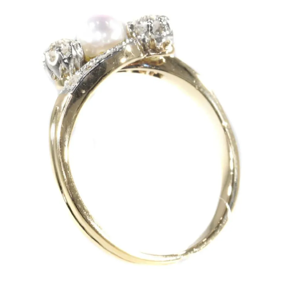 Bague croisée diamant et perle