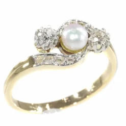 Bague croisée diamant et perle