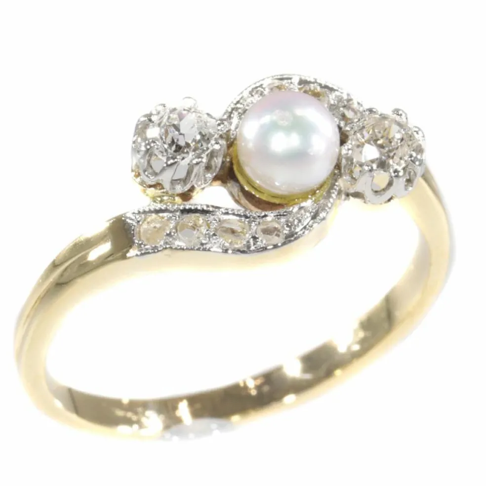 Bague croisée diamant et perle