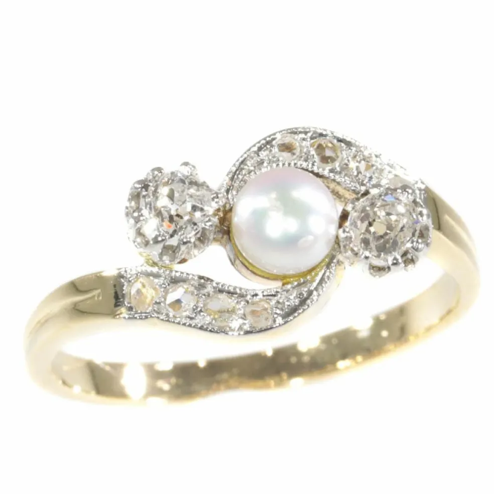 Bague croisée diamant et perle