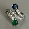 Bague Croisée Or Gris Emeraude Saphir Diamants