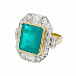 Bague deux ors émeraude et diamants.