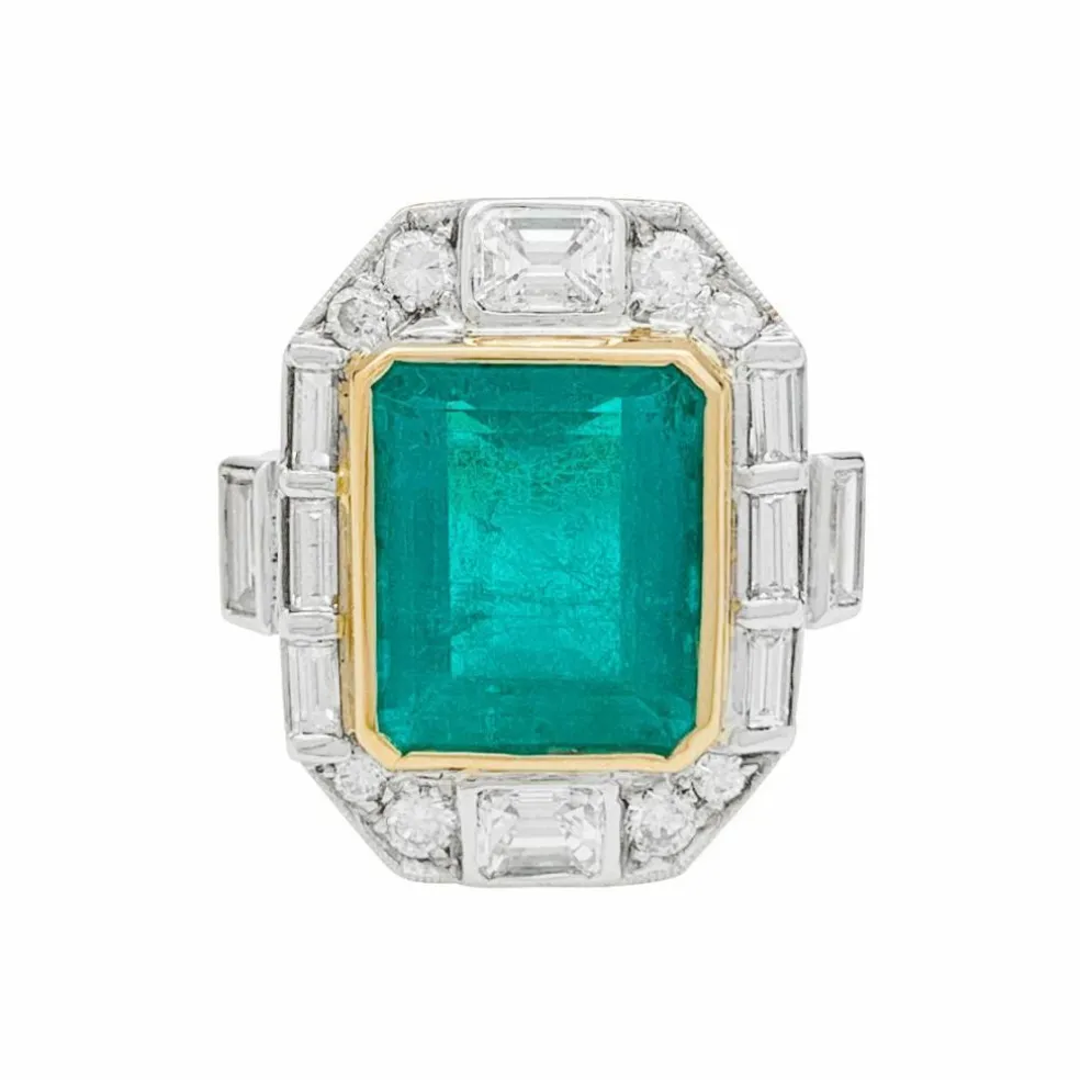 Bague deux ors émeraude et diamants.
