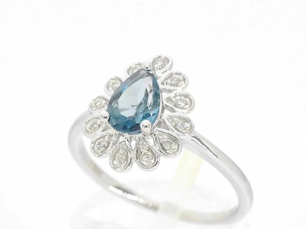 Bague en or blanc avec diamants et topaze
