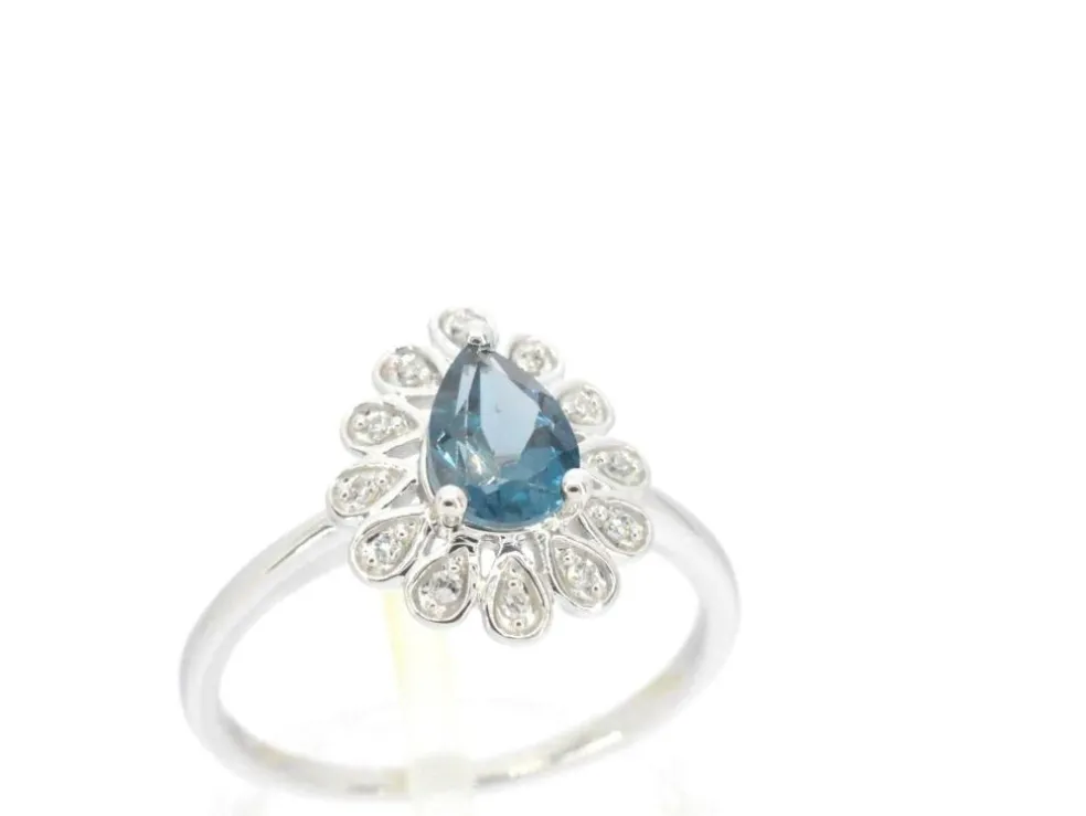 Bague en or blanc avec diamants et topaze