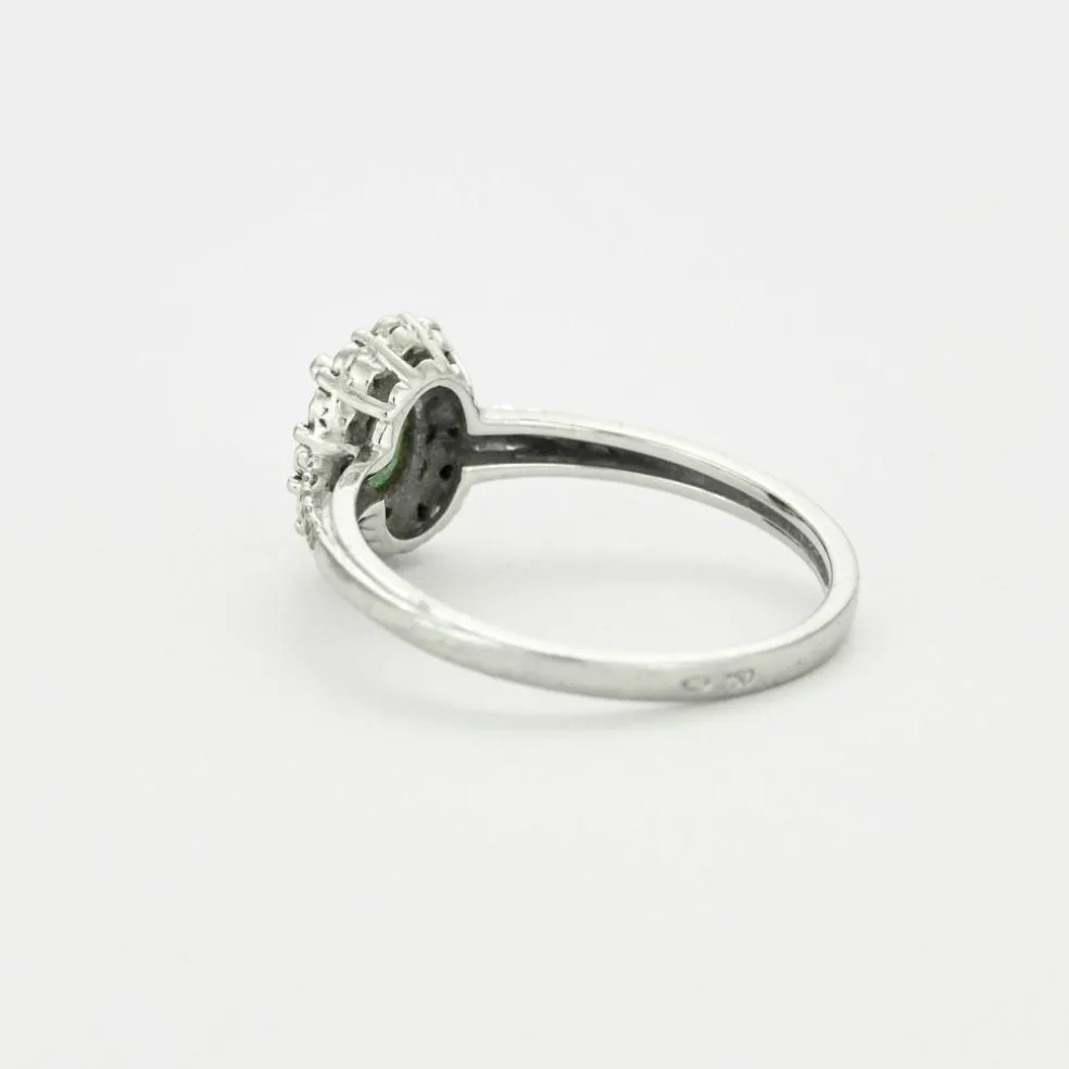 Bague en or gris émeraude et diamants