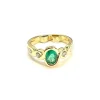 Bague en or jaune 18 carats sertie d'une émeraude ovale et diamants