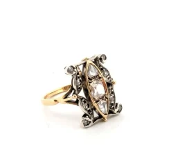Bague en or jaune et argent avec diamant rose central et diamants latéraux