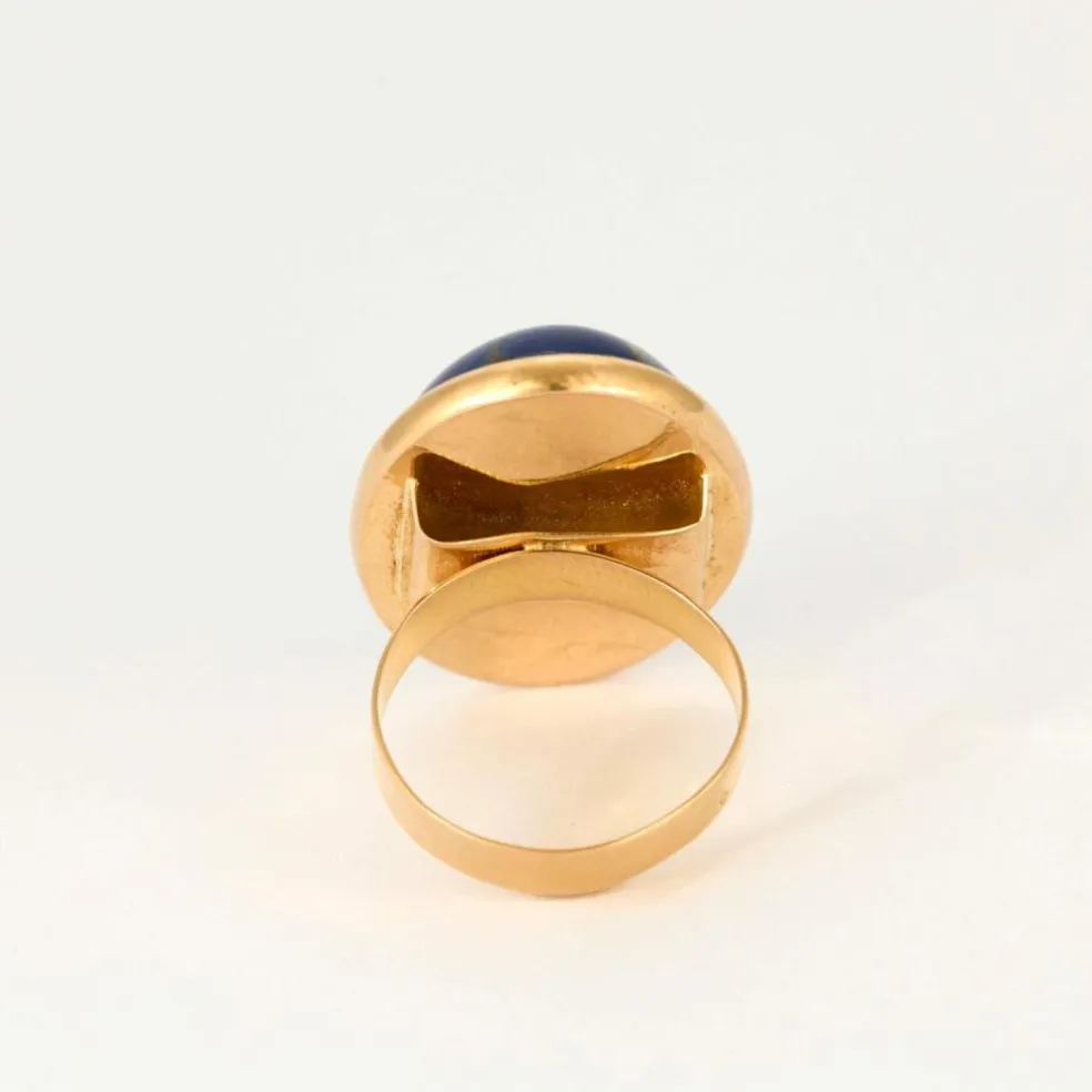 Bague en or jaune et pierre d'imitation bleue.
