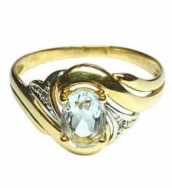 Bague en or jaune, gris, et aigue-marine