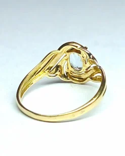 Bague en or jaune, gris, et aigue-marine