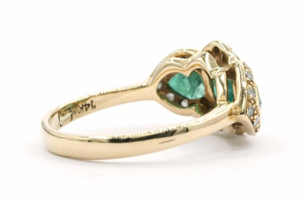 Bague en or jaune sertie d'émeraudes et de diamants