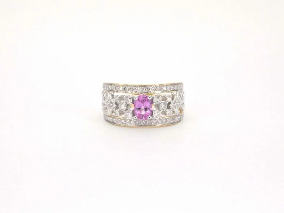 Bague en or jaune sertie de diamants et d'une pierre précieuse