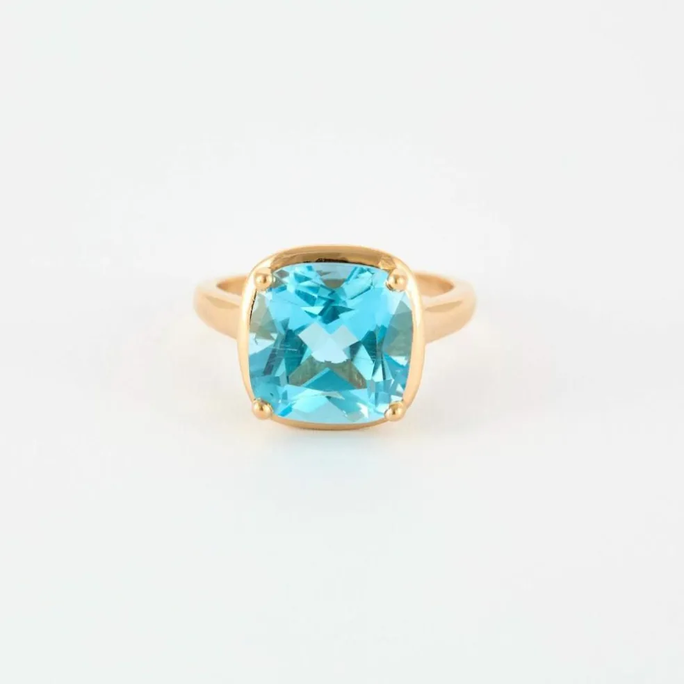 Bague en or rose et topaze bleue