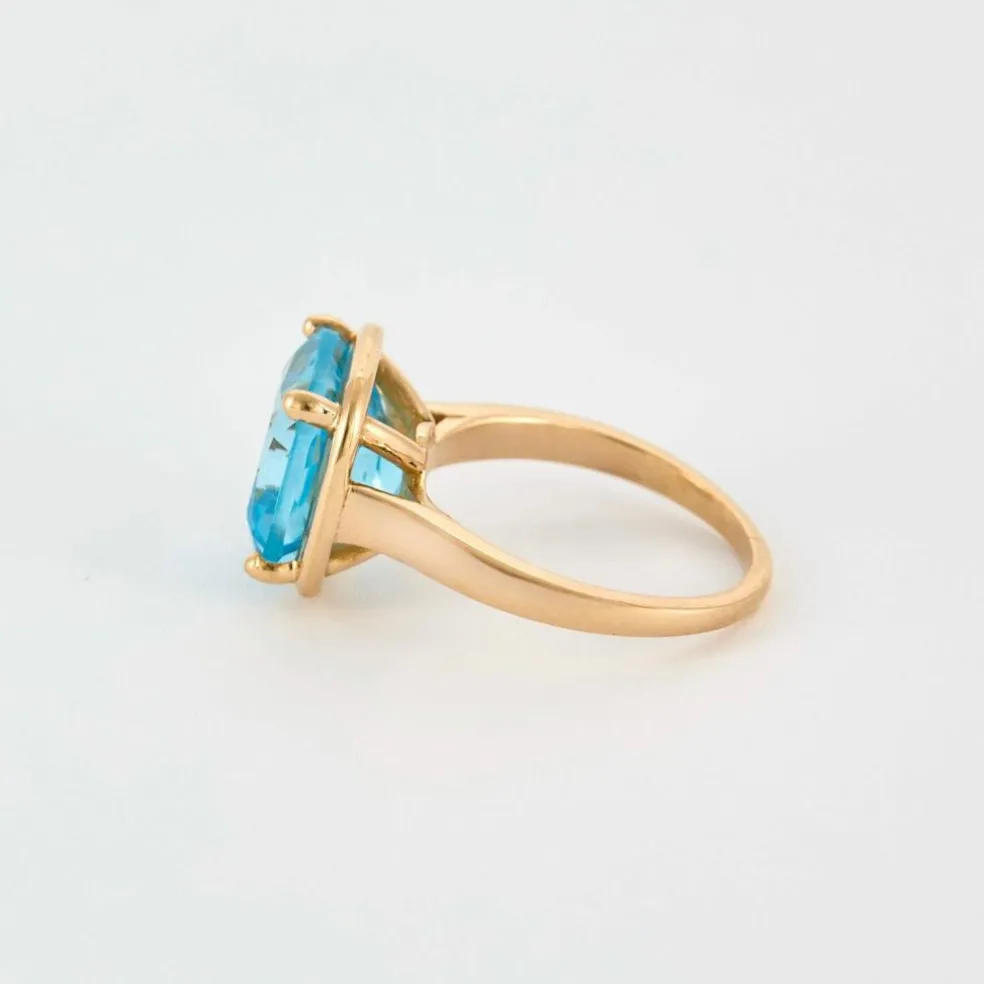 Bague en or rose et topaze bleue