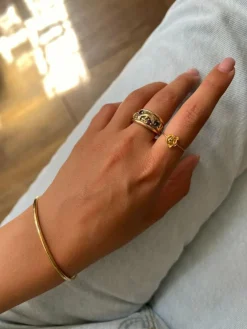 Bague en or sertie de pierres précieuses