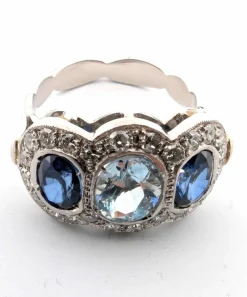 Bague en platine avec aigue-marine centrale, saphirs latéraux et diamants