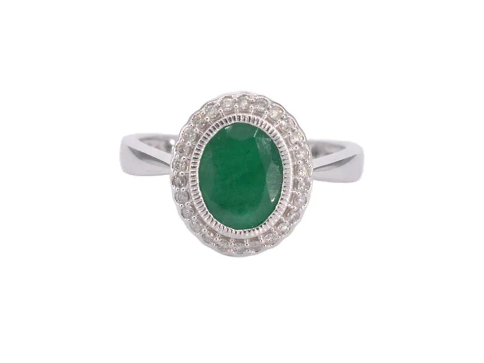 Bague entourage en or blanc avec diamants et émeraude