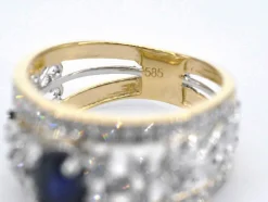 Bague exclusive en or sertie de diamants et d'un saphir