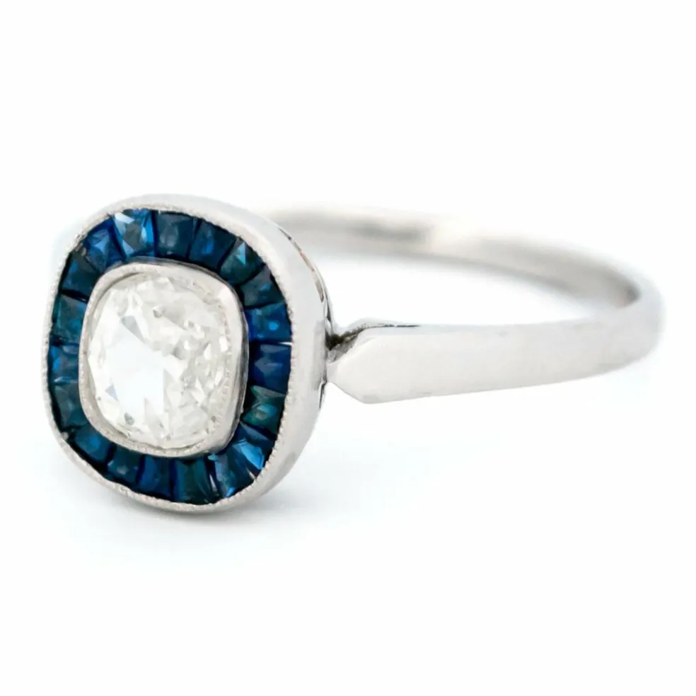 Bague halo en platine avec saphir et diamant