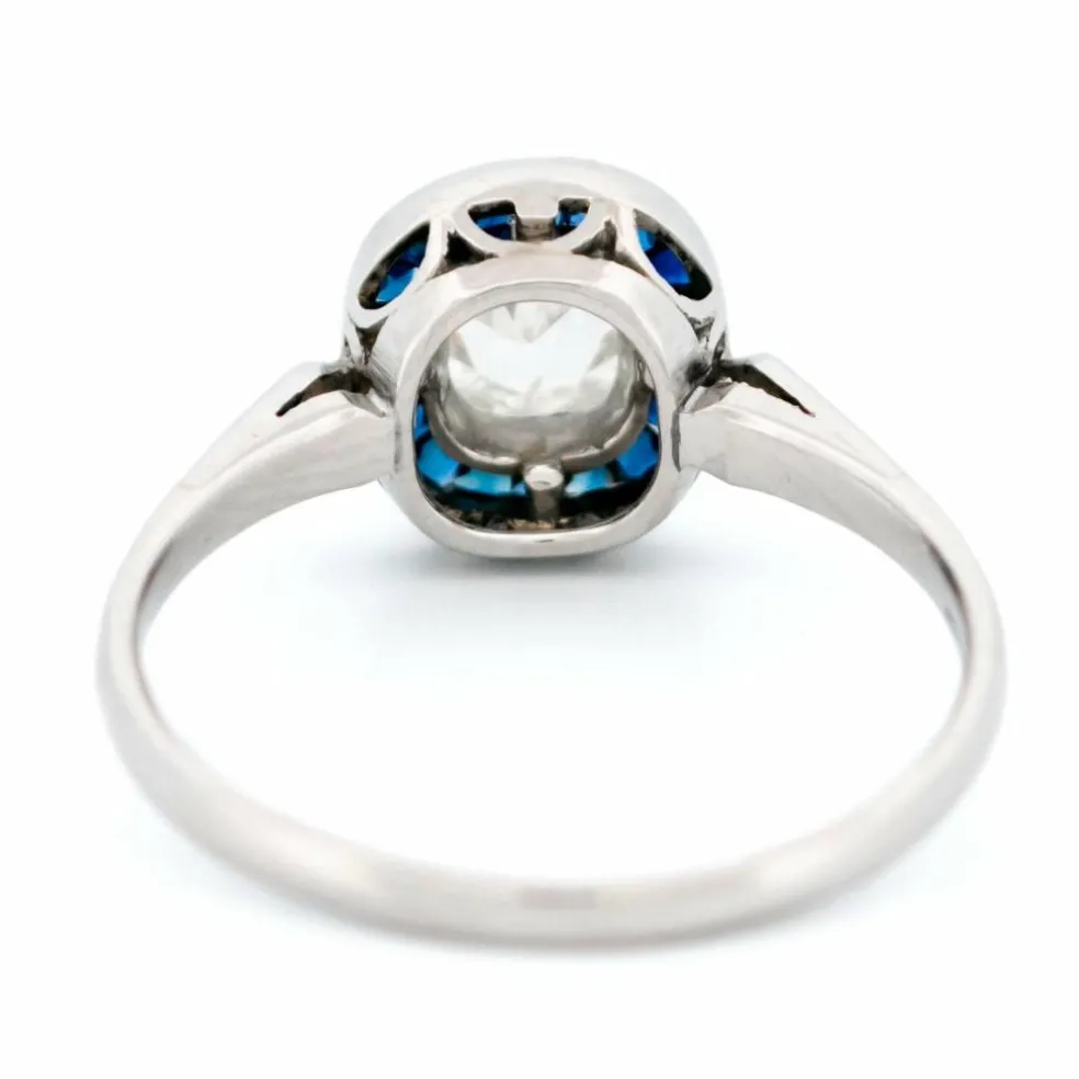 Bague halo en platine avec saphir et diamant