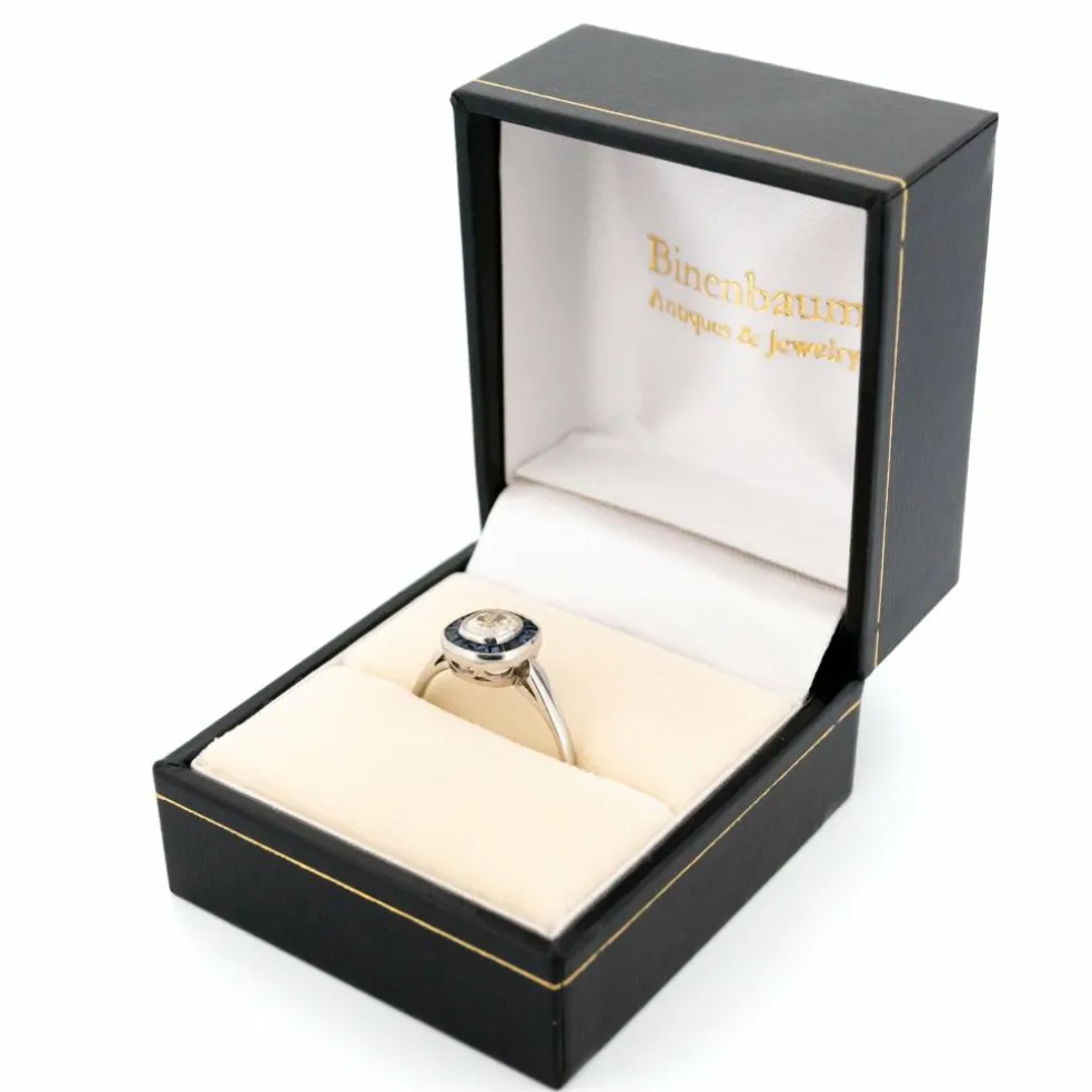 Bague halo en platine avec saphir et diamant