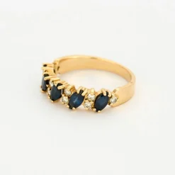 Bague jarretière or jaune saphirs diamants