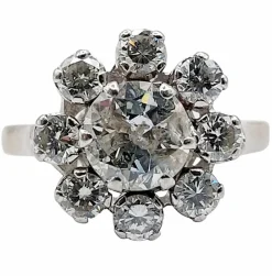 Bague marguerite art déco en or blanc ornée d'un diamant