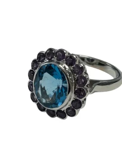Bague Marguerite en or blanc ornée en son centre d'une topaze