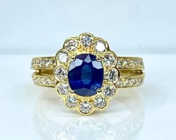 Bague marguerite en or jaune 18 carats, saphir et diamants