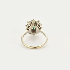 Bague Marguerite or gris et jaune, diamants et émeraude