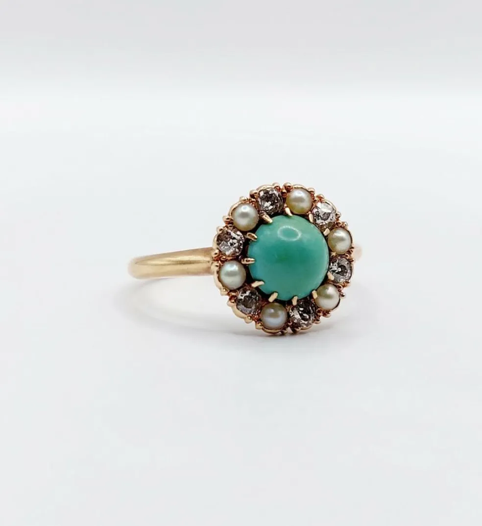 Bague marguerite or jaune, cabochon de turquoise, diamants et perles (circa 1900)