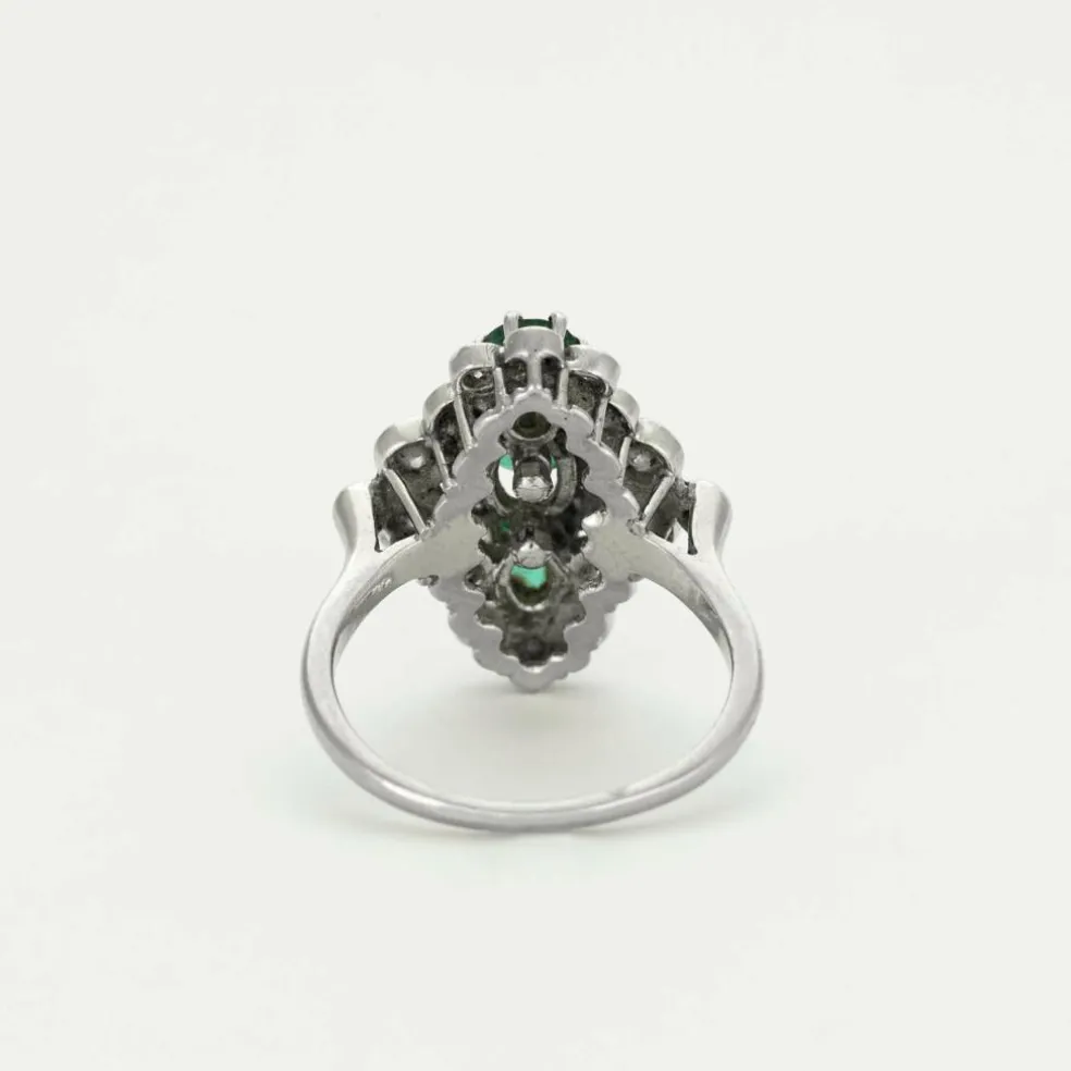 Bague marquise or gris émeraudes et diamants