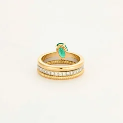 Bague multi-anneaux or jaune platine diamants et émeraude.