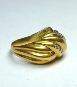 Bague noeud en or jaune gris et diamants
